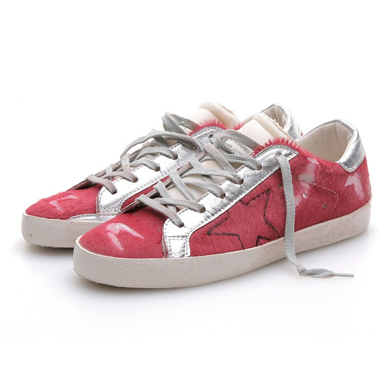 golden goose with red star